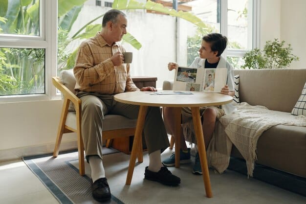 A young Chinese gay man sitting at a table, talking openly with his parents who are listening attentively. The atmosphere is warm and supportive, indicating a healthy and communicative family dynamic.