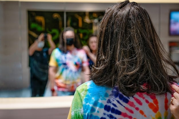 Students participating in a discussion group in a brightly lit university common area. There are posters promoting LGBTQ+ awareness events on the walls.